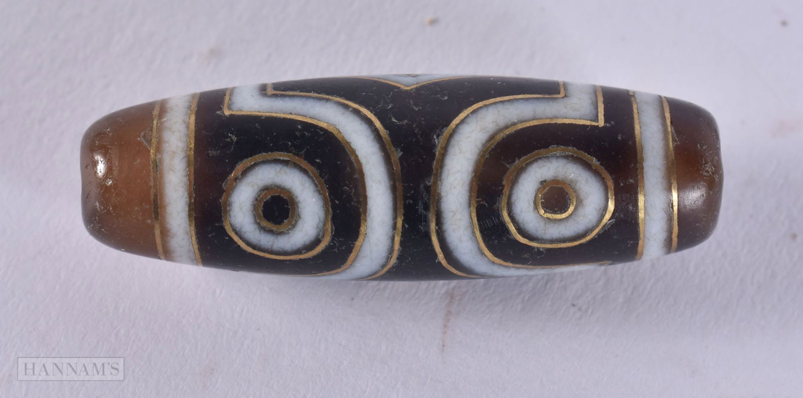 A TIBETAN AGATE ZHU BEAD. 8.5 grams. 3.75 cm wide.: A TIBETAN AGATE ZHU BEAD. 8.5 grams. 3.75 cm wide.
