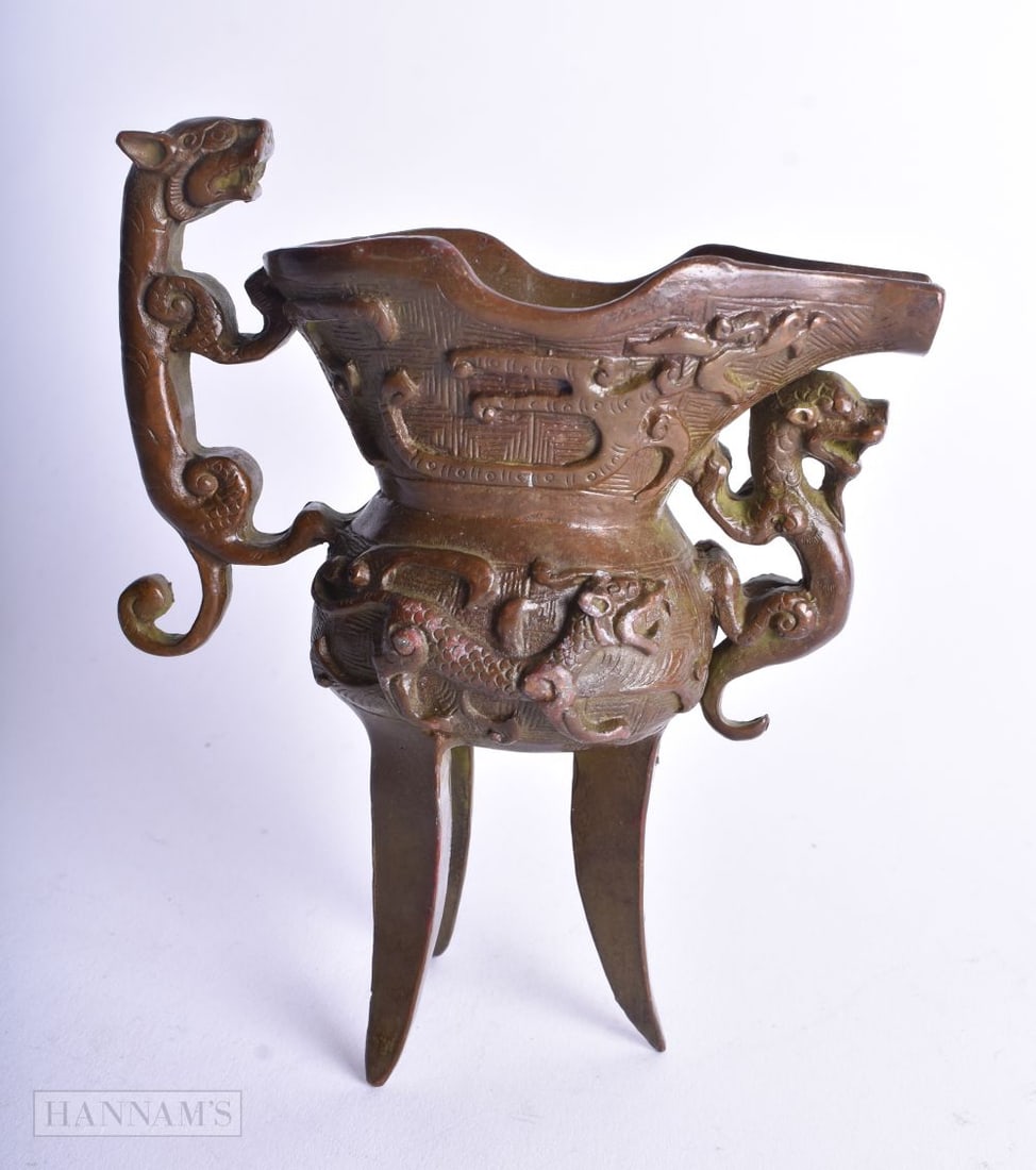 A CHINESE BRONZE JUE WINE CUP. 596 grams. 13 cm x 11.5 cm. (1 of 5)