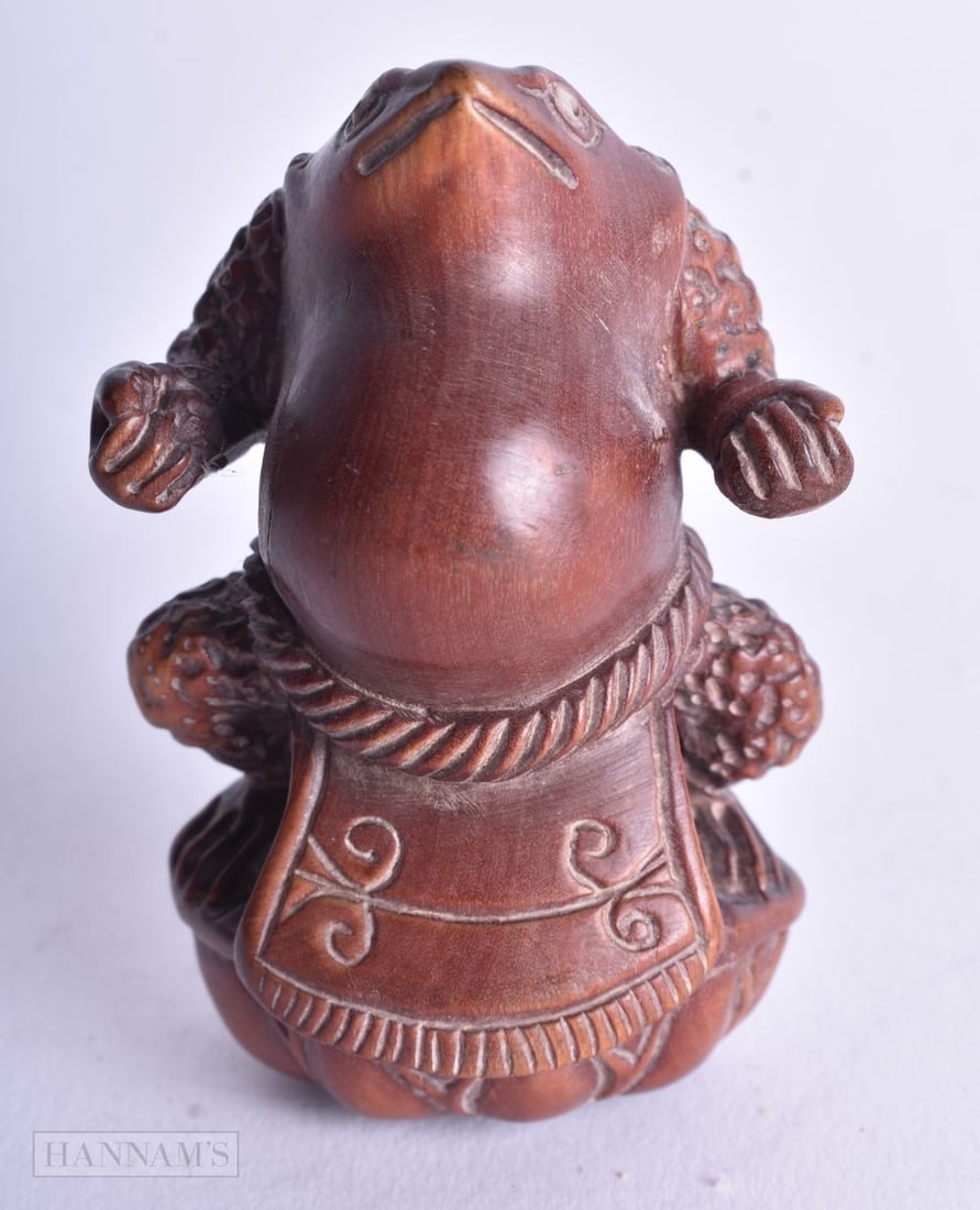 A JAPANESE WOOD NETSUKE. 20.5 grams. 5.75 cm x 4 cm. (1 of 4)