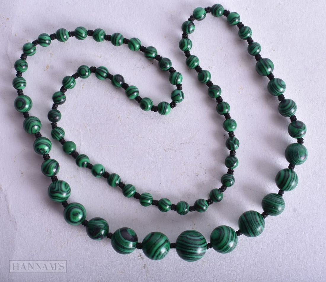 A MALACHITE NECKLACE. 36 grams. 65 cm long. (1 of 3)