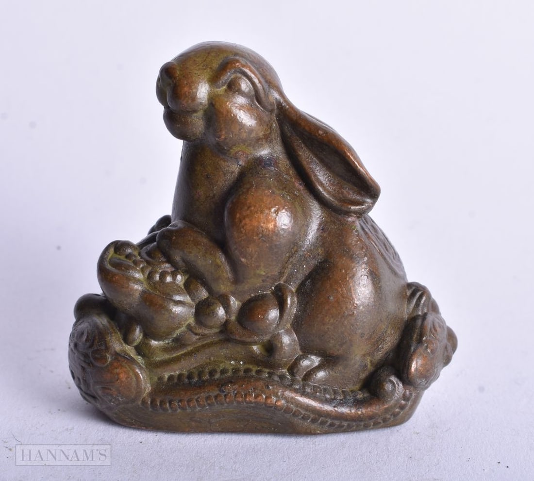 A JAPANESE BRONZE RABBIT. 211.3 grams. 6 cm x 6.25 cm. (1 of 4)