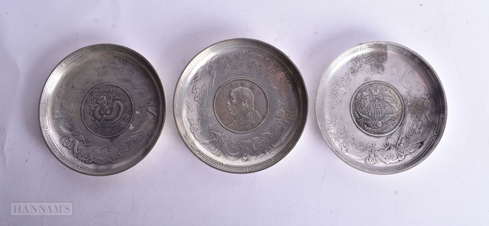THREE CHINESE WHITE METAL COIN DISHES. 327 grams. 9.25 cm wide. (3) (1 of 2)