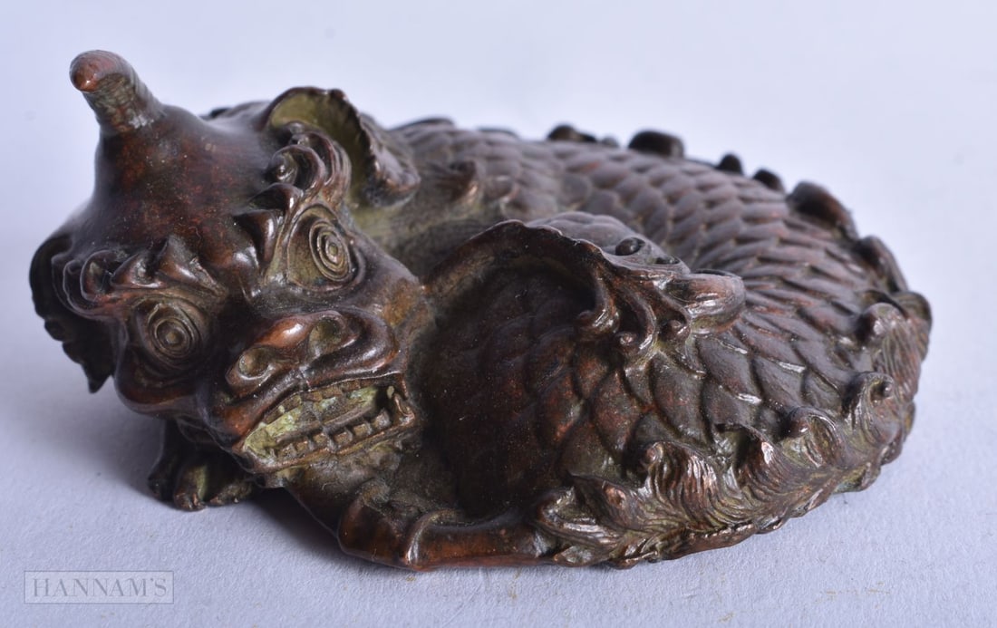 A CHINESE BRONZE DRAGON. 544 grams. 8.25 cm x 7.5 cm. (1 of 3)