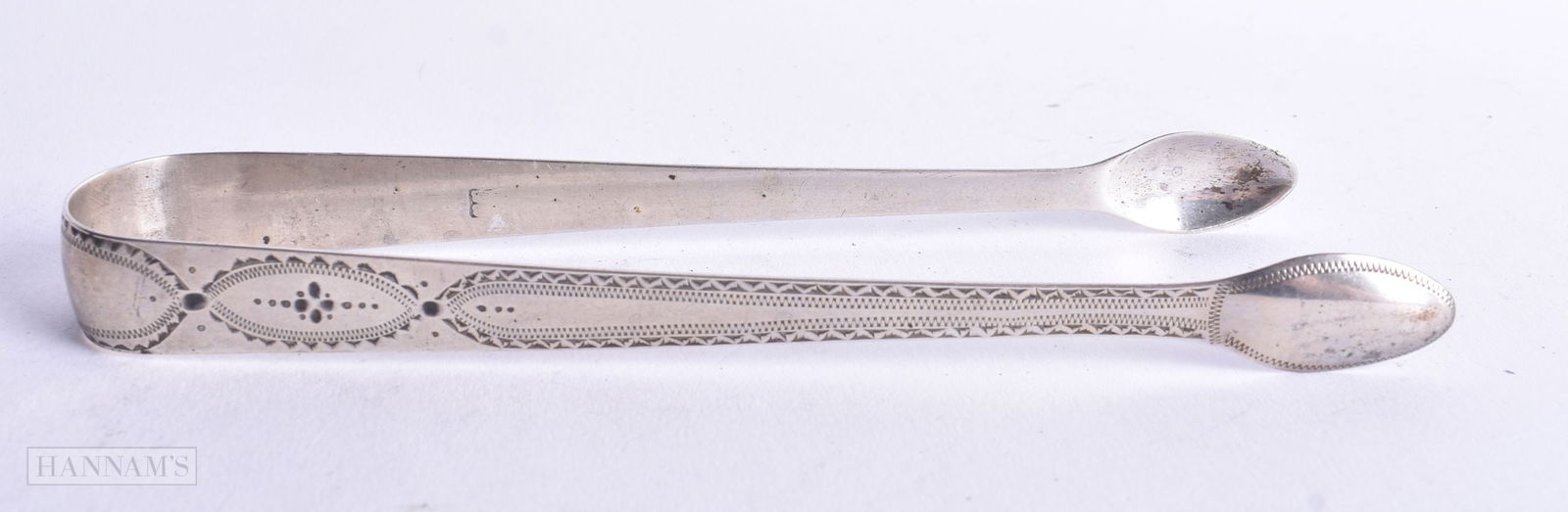 A PAIR OF ANTIQUE SILVER SUGAR TONGS. London 1811. 30 grams. 15 cm long. (1 of 3)