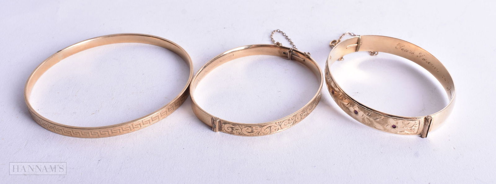 THREE GOLD FILLED BANGLES. 59 grams. 7.25 cm wide. (3) (1 of 5)