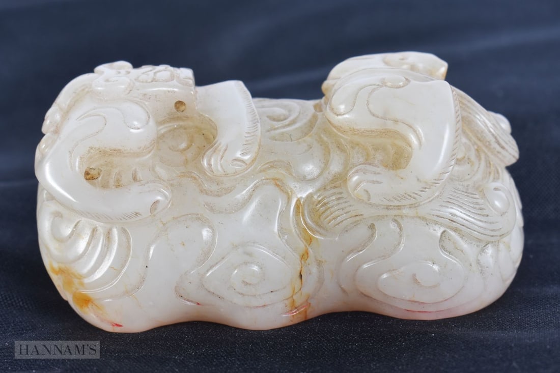 A FINE CHINESE QING DYNASTY CARVED WHITE JADE SEAL modelled as a stylised dragon. 6.25 cm x 3.25 cm. (1 of 6)