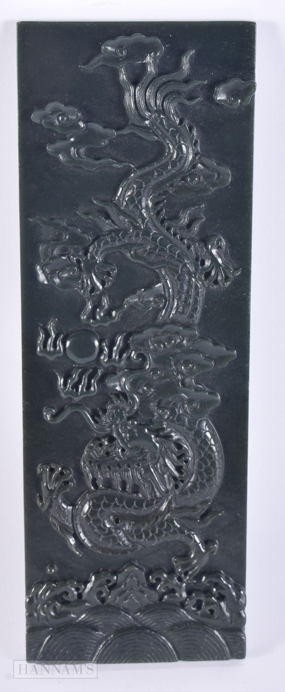 A CHINESE CARVED SPINACH JADE DRAGON PLAQUE. 21.5 cm x 7 cm.: A CHINESE CARVED SPINACH JADE DRAGON PLAQUE. 21.5 cm x 7 cm.