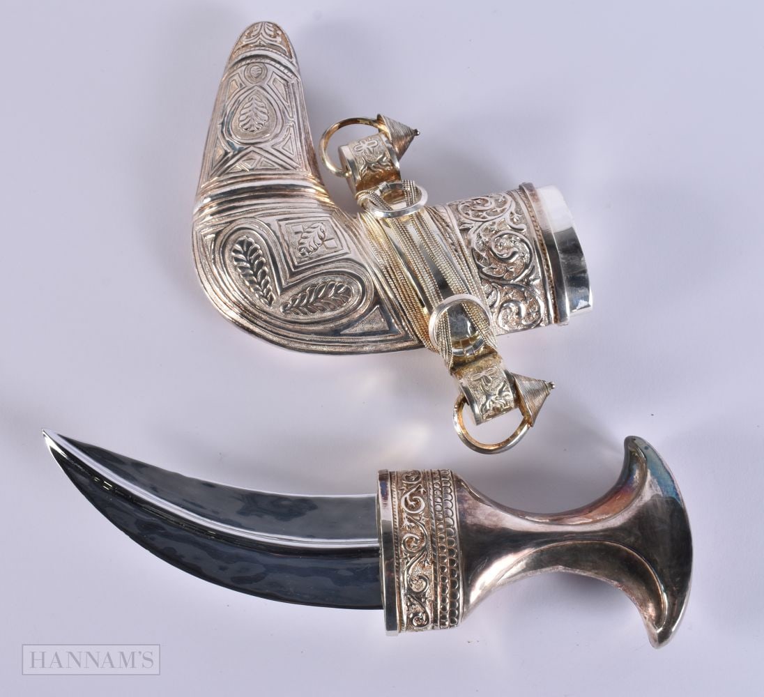 A MIDDLE EASTERN OMANI SILVER CASED JAMBIYA DAGGER. 697 grams overall. 28cm x 16 cm. WE ARE UNABLE (1 of 5)