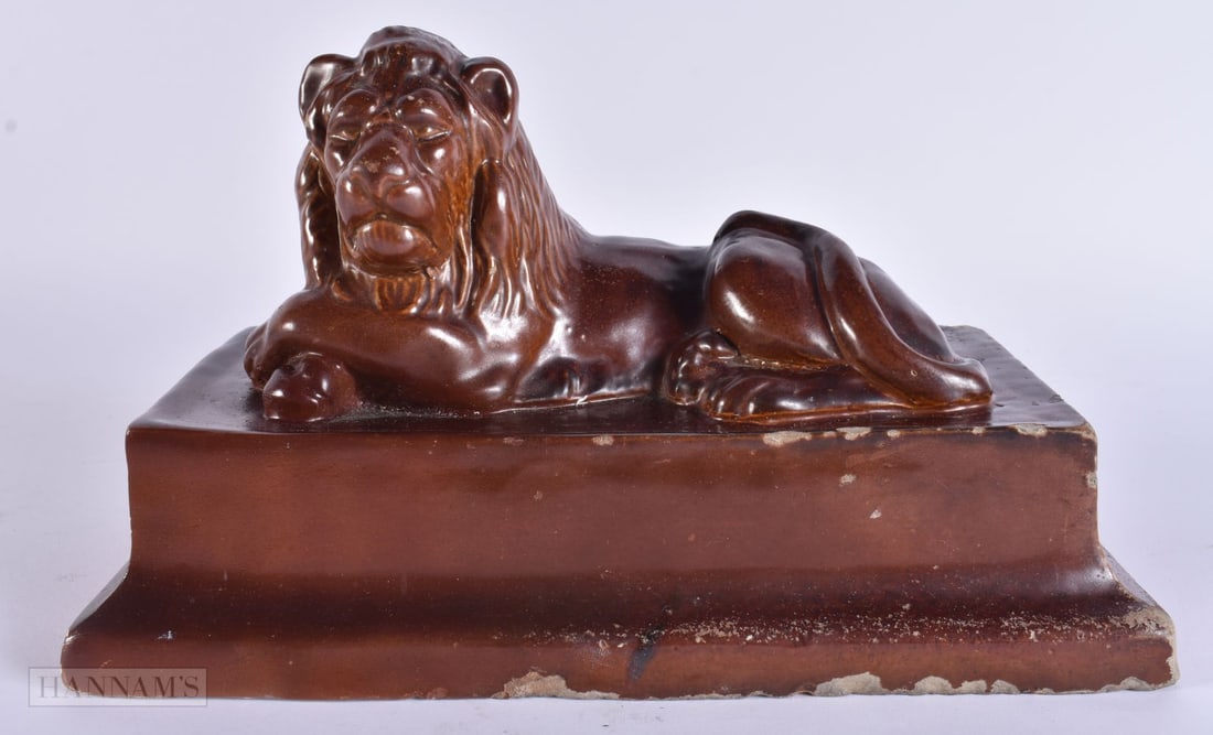AN EARLY 19TH CENTURY SALT GLAZED BRAMPTON POTTERY LION. 24 cm x 16 cm. (1 of 6)