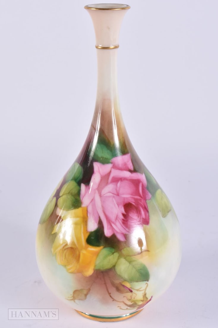 A ROYAL WORCESTER PORCELAIN VASE painted with roses. 22.5 cm high. (1 of 5)