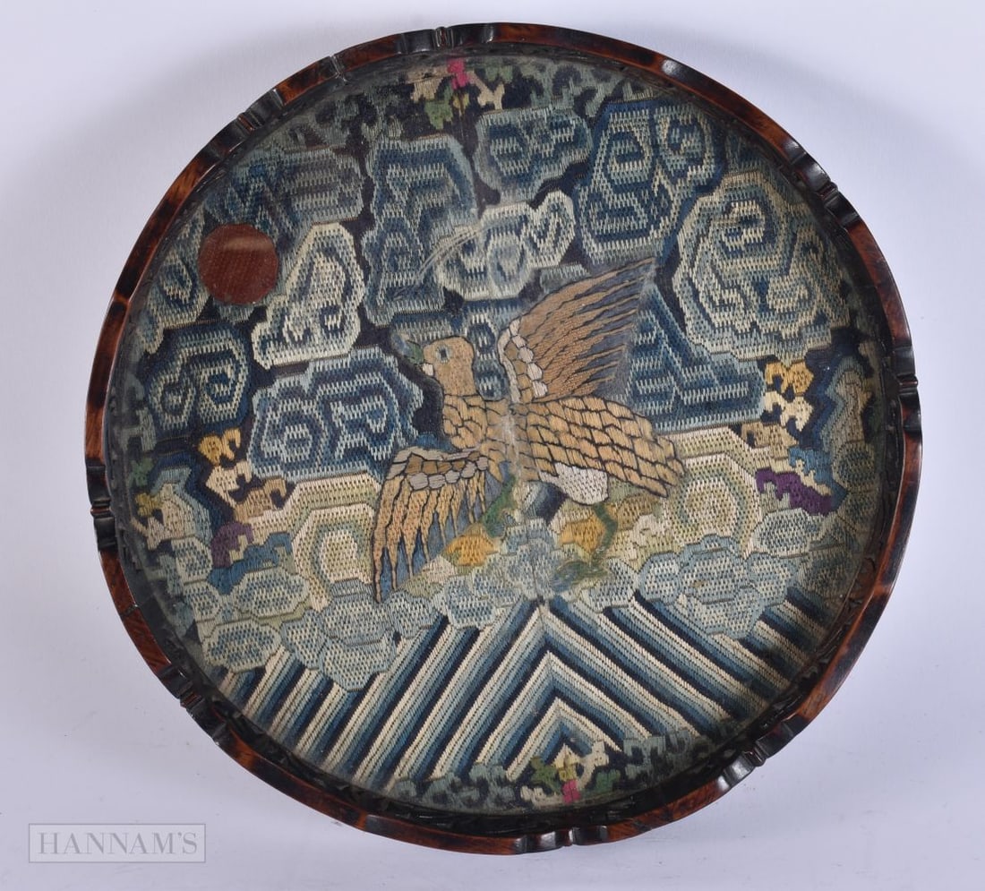 A CHINESE QING DYNASTY SILK EMBROIDERED RANK BADGE contained within a hardwood tray. 25 cm wide. (1 of 6)