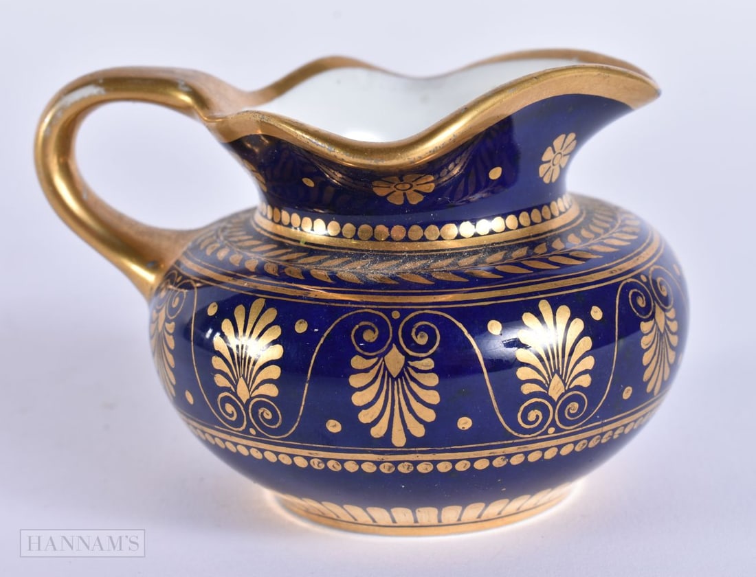 AN ANTIQUE FRENCH SEVRES PORCELAIN JUG. 8.5 cm wide.: AN ANTIQUE FRENCH SEVRES PORCELAIN JUG. 8.5 cm wide.