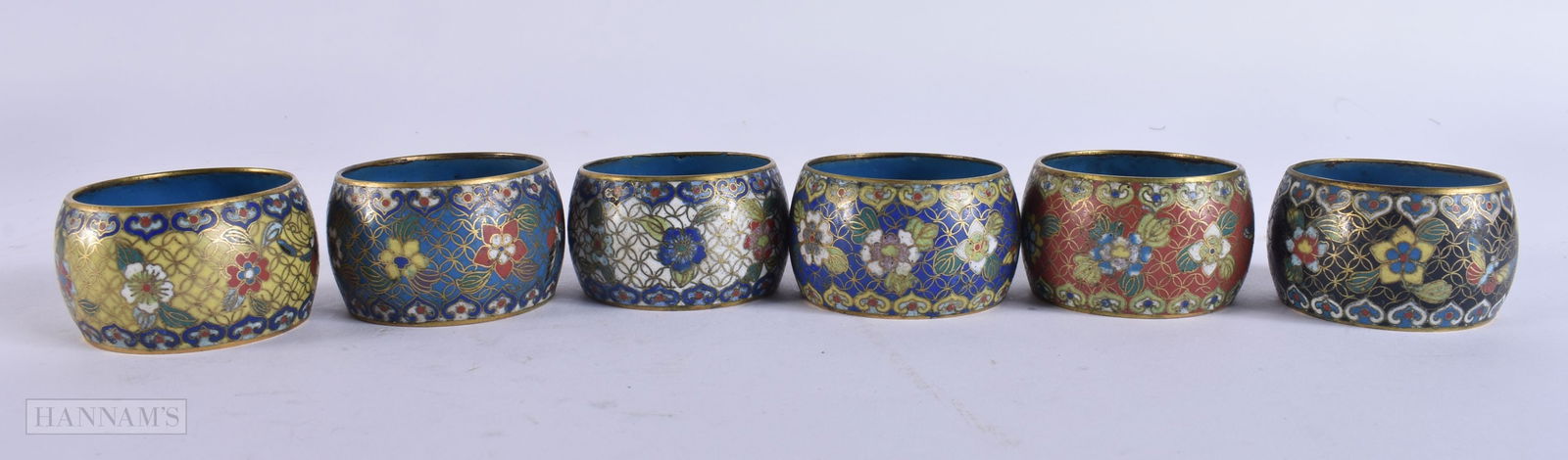 A SET OF SIX EARLY 20TH CENTURY CHINESE CLOISONNE ENAMEL NAPKIN RINGS Late Qing. 5 cm wide. (6): A SET OF SIX EARLY 20TH CENTURY CHINESE CLOISONNE ENAMEL NAPKIN RINGS Late Qing. 5 cm wide. (6)