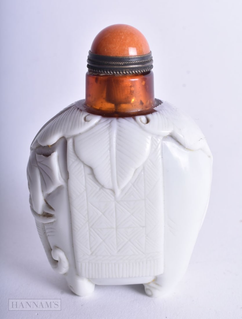 A Peking Glass Snuff Bottle in the form of an Elephant. 8.7cm x 6cm x 3.6cm, weight 166g: A Peking Glass Snuff Bottle in the form of an Elephant. 8.7cm x 6cm x 3.6cm, weight 166g