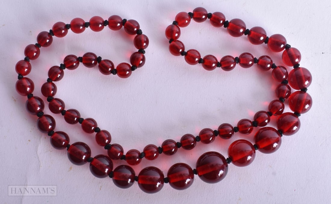A Graduated Bead Necklace. Largest Bead 15mm, Length 66cm, weight 36g (1 of 2)
