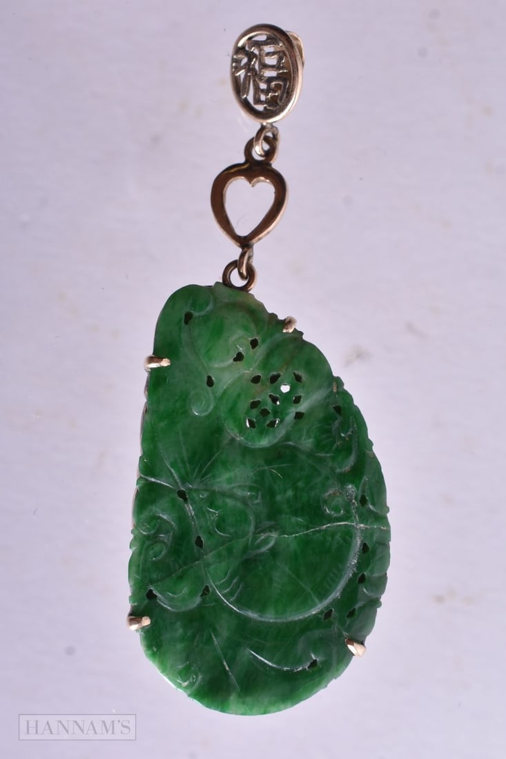 A 14 Carat Gold Mounted Jade Pendant. Stamped 14K, 5.7cm x 2.1cm, weight 6.2g (1 of 2)