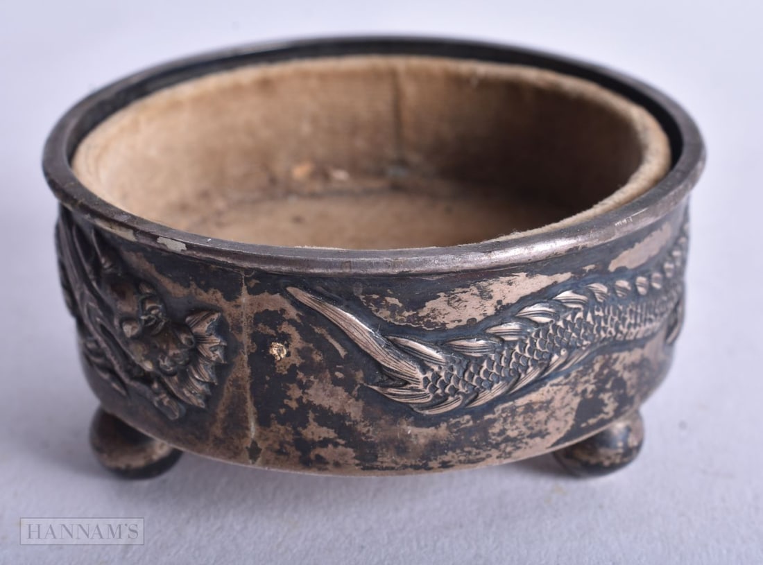 A Chinese Wang Hing Silver Ring Dish with Embossed Dragon Decoration and Bun Feet. 6.3cm x 3cm, wei: A Chinese Wang Hing Silver Ring Dish with Embossed Dragon Decoration and Bun Feet. 6.3cm x 3cm, weight 53g
