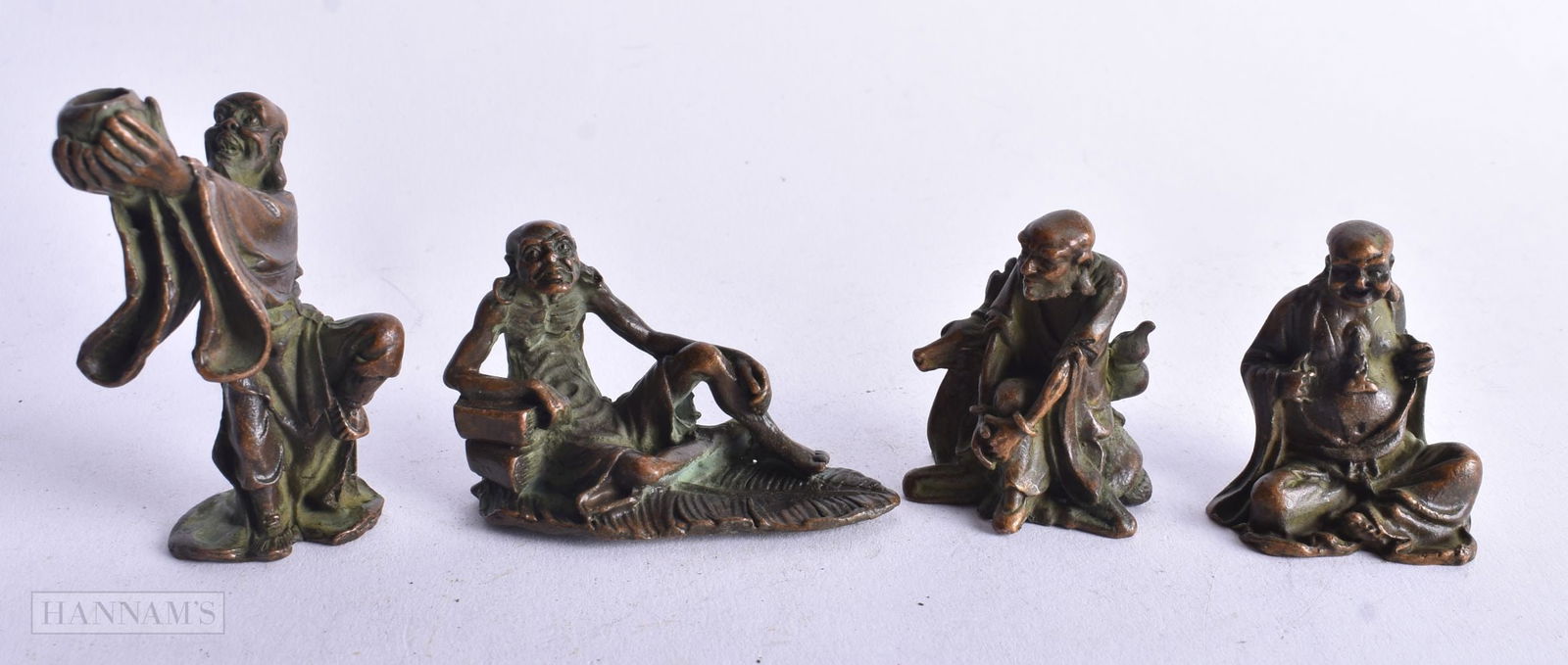 Four Bronze Figures in various poses. Largest 6.5 cm x 4.1cm x 3.2cm, total weight 280g (4): Four Bronze Figures in various poses. Largest 6.5 cm x 4.1cm x 3.2cm, total weight 280g (4)