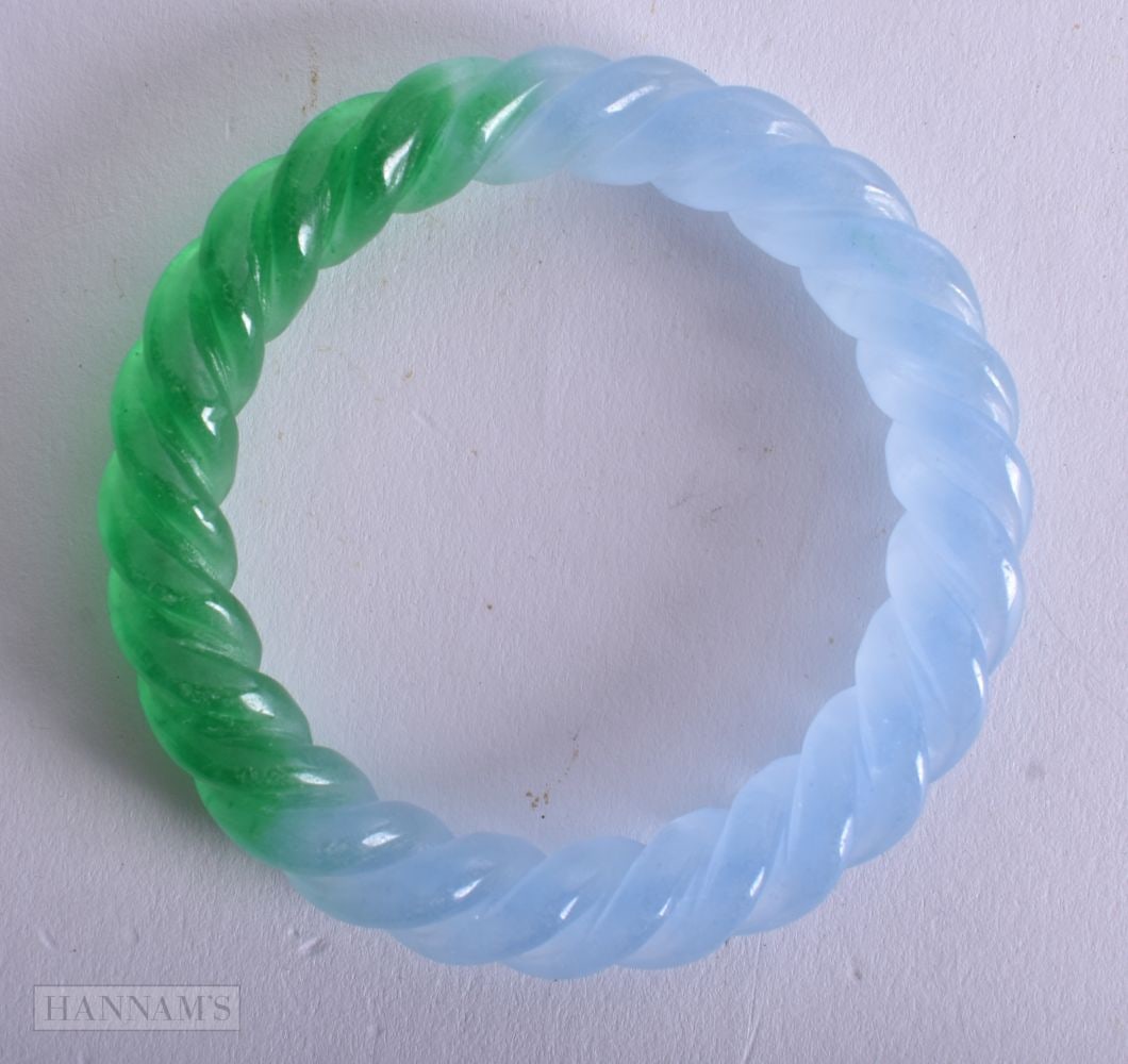 A Two Tone Hardstone Twist Bangle. Internal Diameter 5.9cm, weight 50g: A Two Tone Hardstone Twist Bangle. Internal Diameter 5.9cm, weight 50g