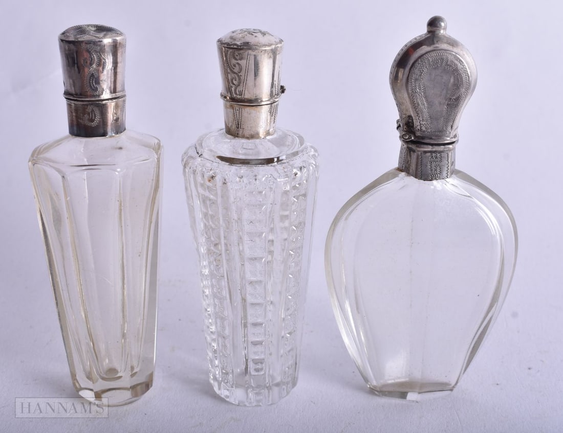 Three Silver Mounted Glass Scent Bottles. Dutch Marks, weight 138g. Largest 8.5 cm high. (3) (1 of 4)