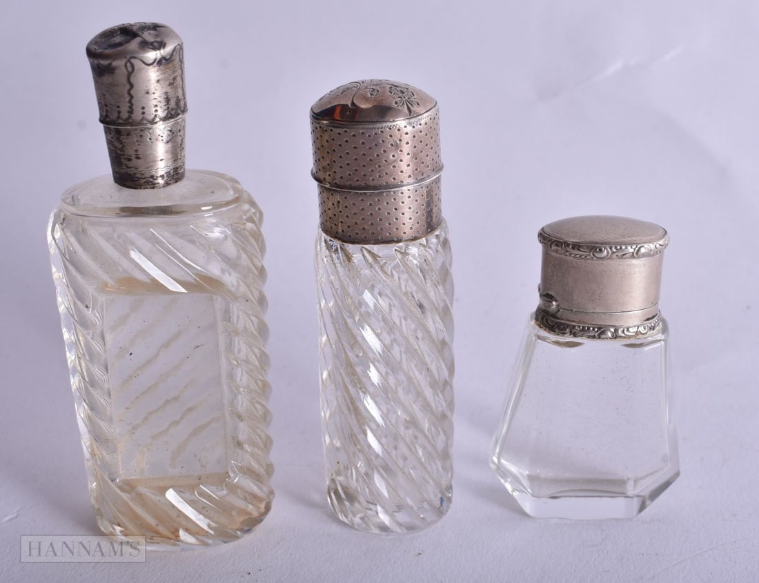 Three Silver Mounted Glass Scent Bottles. Dutch Marks, weight 110g. Largest 8.9 cm high. (3) (1 of 4)