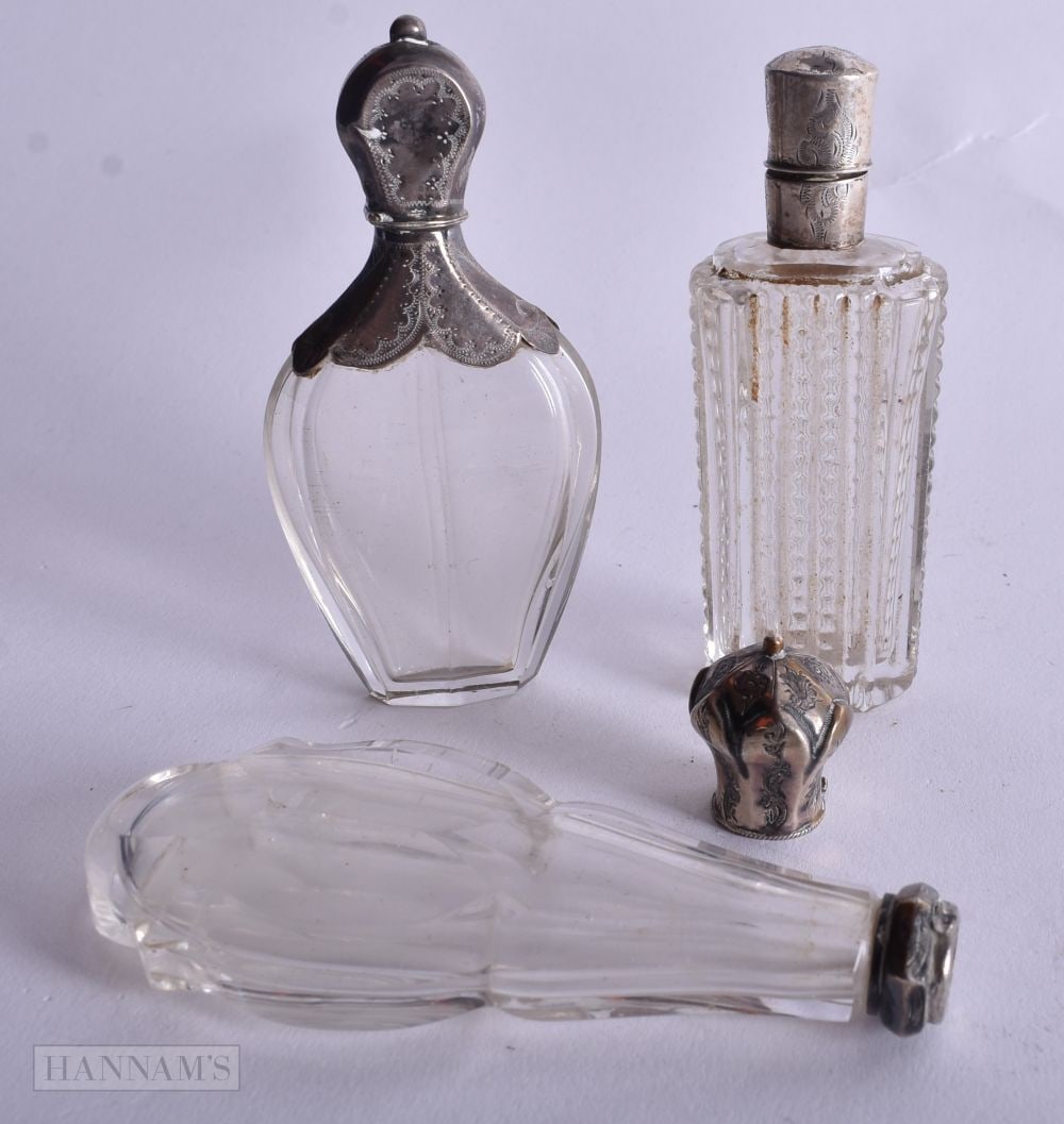 Three Silver Mounted Glass Scent Bottles. Dutch Marks, weight 157g. Largest 12.1cm high. (3) (1 of 3)