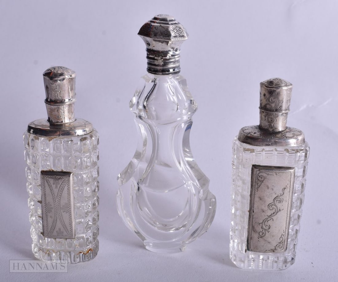 Three Silver Mounted Glass Scent Bottles. Dutch Marks, weight 196g. Largest 11cm high. (3) (1 of 4)