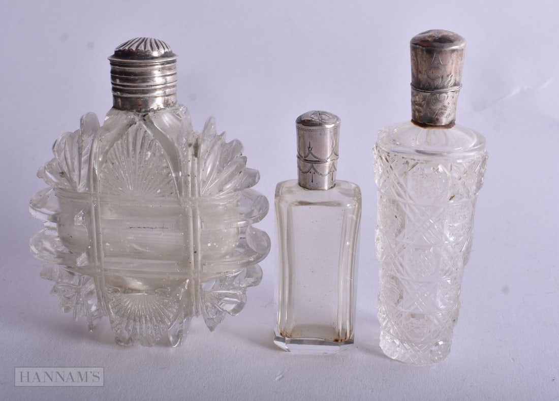 Three Silver Mounted Glass Scent Bottles. Dutch Marks, weight 242g. Largest 8.9cm high. (3) (1 of 4)