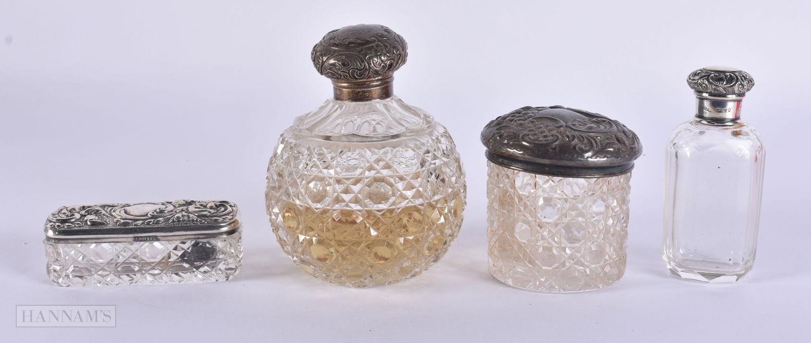 AN ANTIQUE SILVER MOUNTED SCENT BOTTLES etc. Largest 8 cm high. (4) (1 of 7)