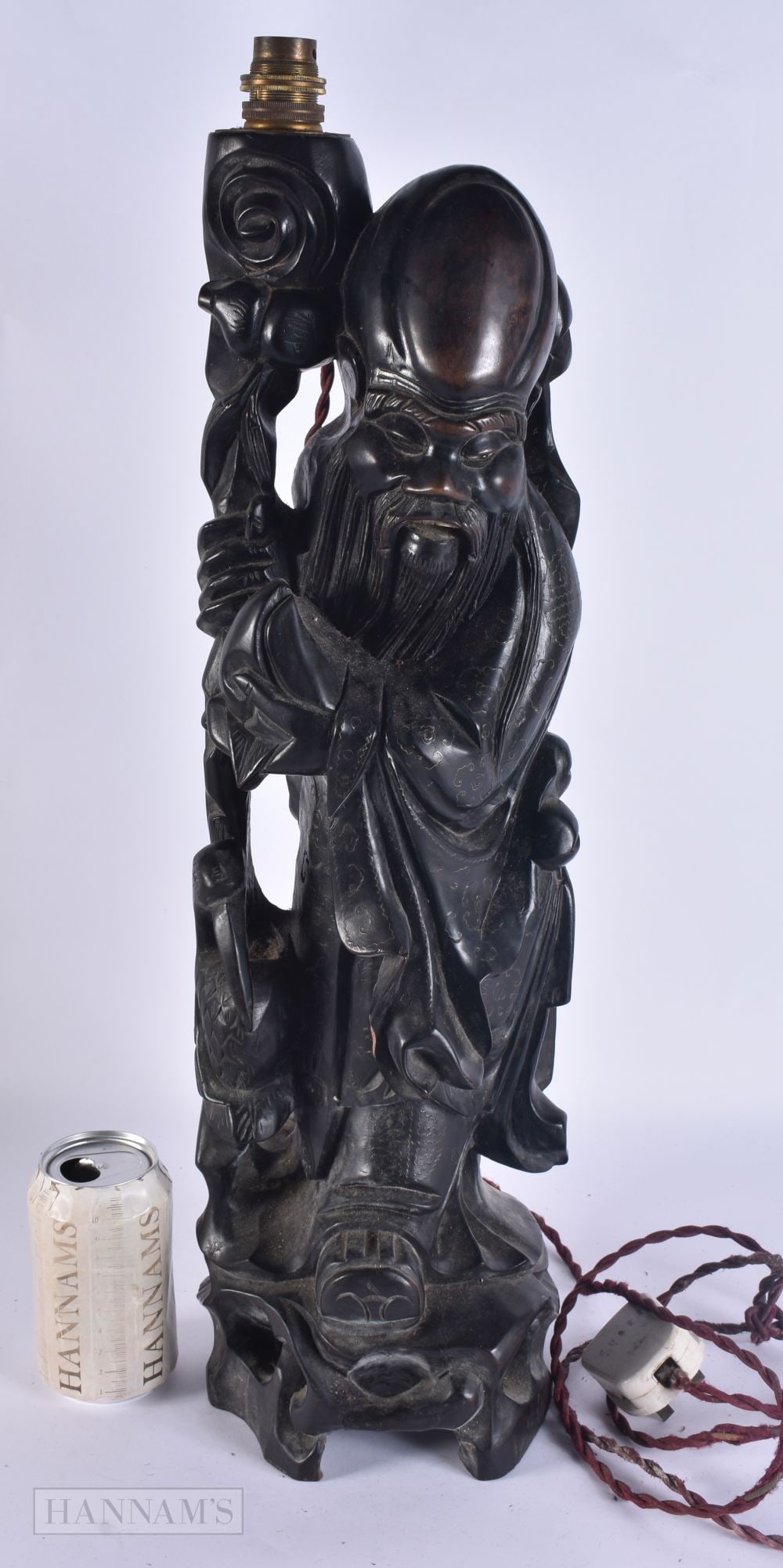 A LARGE 19TH CENTURY CHINESE COUNTRY HOUSE CARVED WOOD FIGURAL LAMP with silver inlay. 58cm high.: A LARGE 19TH CENTURY CHINESE COUNTRY HOUSE CARVED WOOD FIGURAL LAMP with silver inlay. 58cm high.