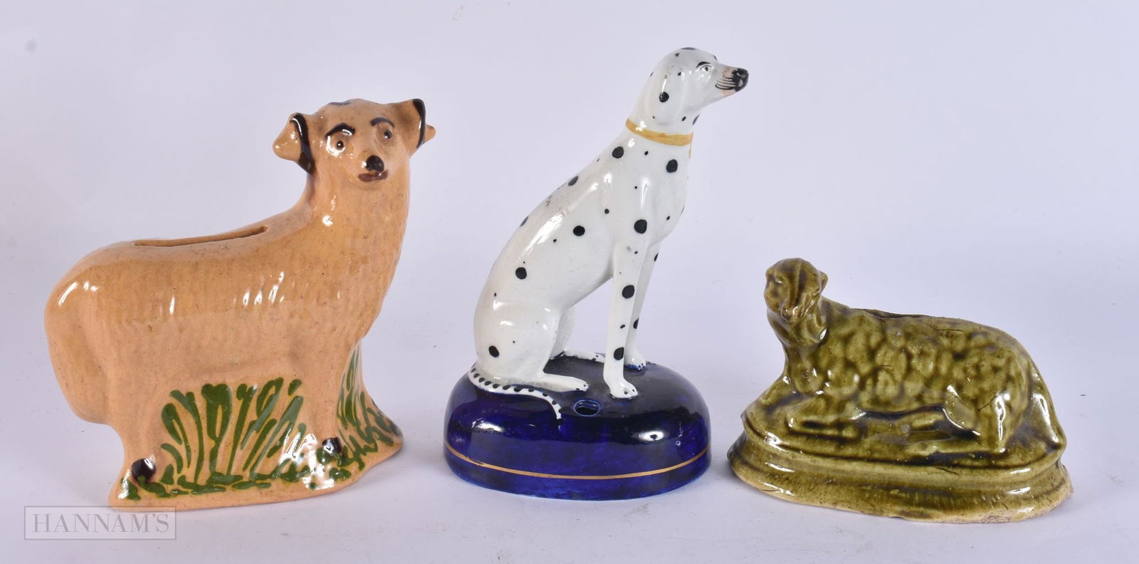 TWO POTTERY MONEY BOXES and a Staffordshire figure. Largest 15 cm high. (3): TWO POTTERY MONEY BOXES and a Staffordshire figure. Largest 15 cm high. (3)