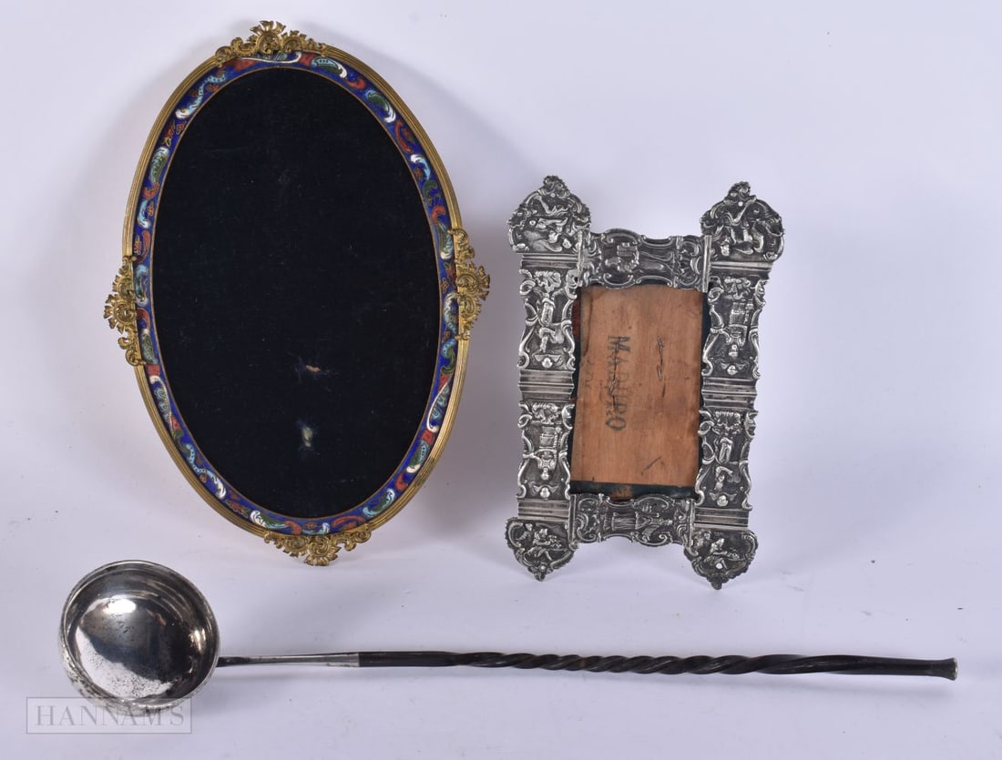 AN ANTIQUE SILVER AND HORN LADLE together with a white metal frame and another. Largest 30 cm long.: AN ANTIQUE SILVER AND HORN LADLE together with a white metal frame and another. Largest 30 cm long. (3)