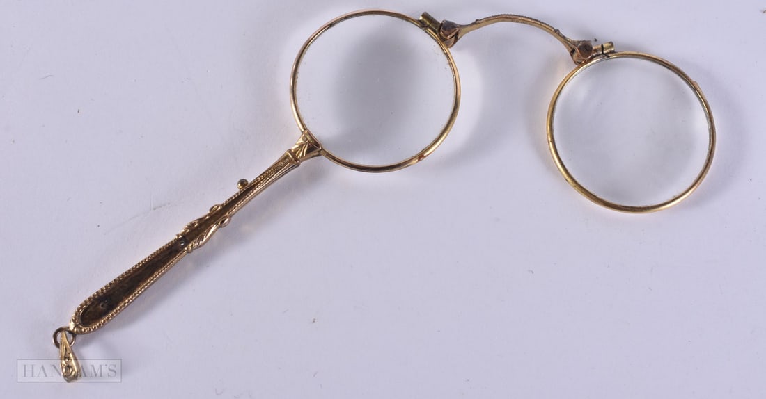 A PAIR OF YELLOW METAL LORGNETTES. 12 cm x 8 cm.: A PAIR OF YELLOW METAL LORGNETTES. 12 cm x 8 cm.