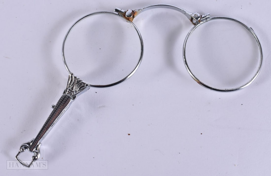 A PAIR OF WHITE METAL LORGNETTES. 10 cm x 8 cm.: A PAIR OF WHITE METAL LORGNETTES. 10 cm x 8 cm.