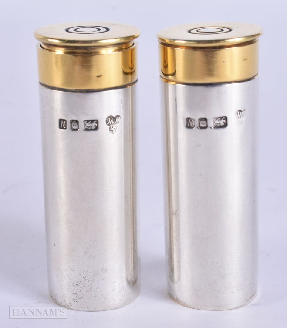 A PAIR OF ENGLISH SILVER SHOTGUN SHELL CONDIMENTS. 83 grams. 6.25 cm high.: A PAIR OF ENGLISH SILVER SHOTGUN SHELL CONDIMENTS. 83 grams. 6.25 cm high.