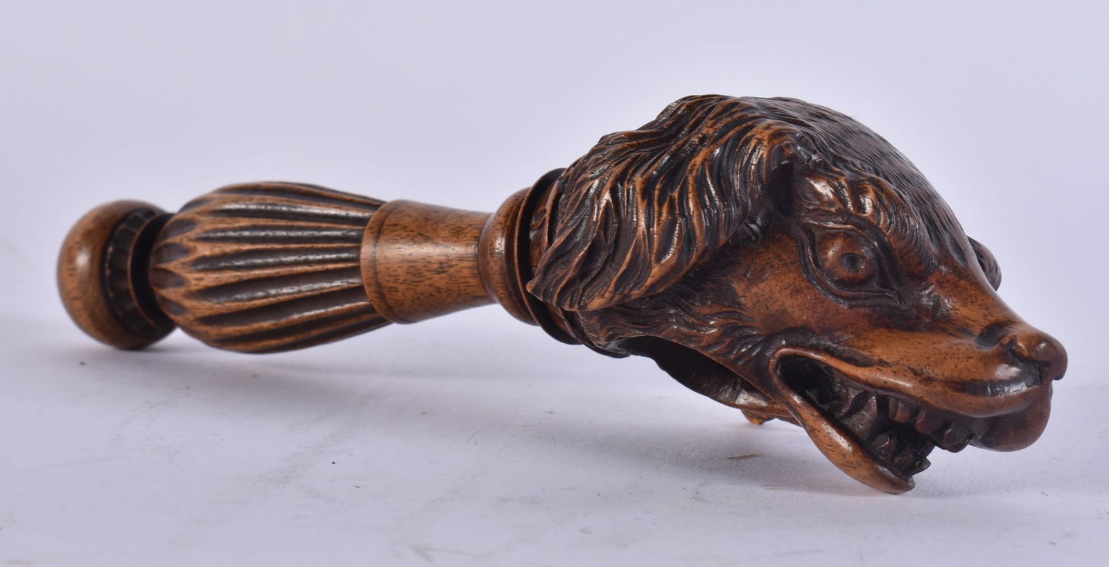 A RARE 19TH CENTURY BAVARIAN TREEN CARVED WOOD NUT CRACKER formed as a scowling hound. 18.5 cm wide. (1 of 4)