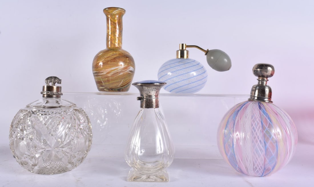 TWO SILVER MOUNTED GLASS SCENT BOTTLES together with two other scent bottles and a glass vase. Large (1 of 9)