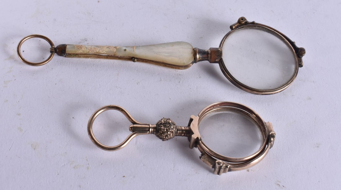 A PAIR OF MOTHER OF PEARL LORGNETTES together with a pair of yellow metal lorgnettes. Largest 14 cm (1 of 2)