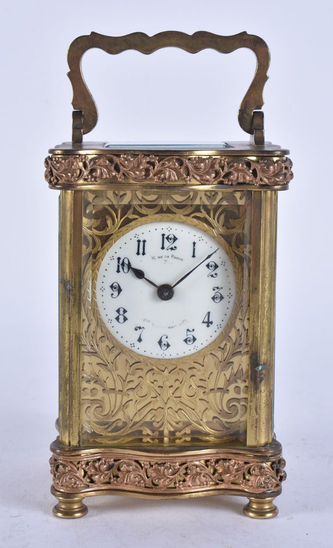 AN ANTIQUE FRENCH FILIGREE CARRIAGE CLOCK. Not running. 15 cm high inc handle. (1 of 2)