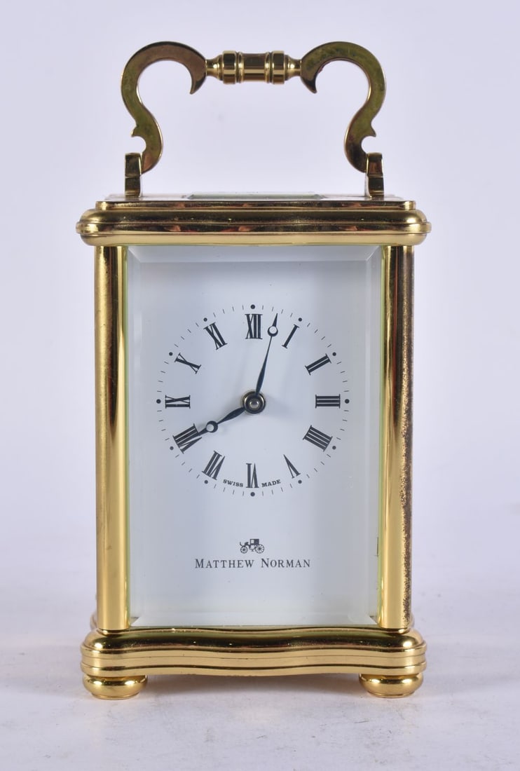 A MATTHEW NORMAN CARRIAGE CLOCK. Working. 14 cm high inc handle. (1 of 4)