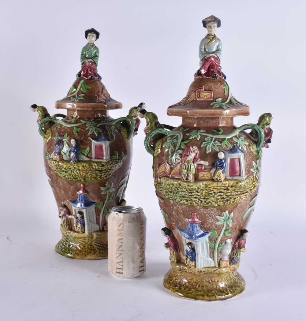 A RARE LARGE PAIR OF 19TH CENTURY MAJOLICA VASES AND COVERS unusually formed with Chinese figures an (1 of 9)