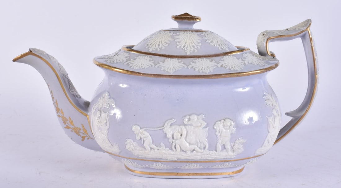 AN EARLY 19TH CENTURY ENGLISH LAVENDER GLAZED TEAPOT AND COVER decorated in relief with classical sc (1 of 4)