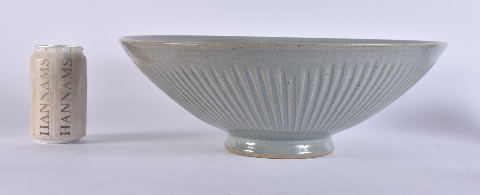 A STYLISH LARGE STUDIO POTTERY FLARED BOWL of ribbed conical form. 35 cm x 12 cm.: A STYLISH LARGE STUDIO POTTERY FLARED BOWL of ribbed conical form. 35 cm x 12 cm.