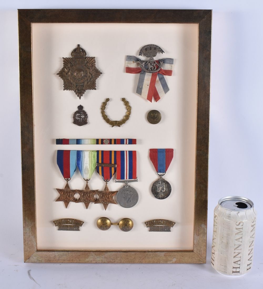 A FRAMED MILITARY MEDAL GROUP including a Royal marines helmet plate & insignia, a Somerset light in (1 of 5)