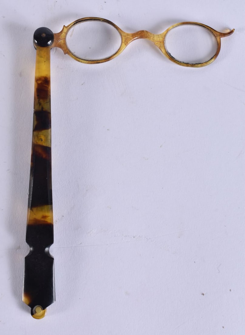 A PAIR OF TORTOISESHELL LORGNETTES. 25 cm long extended. (1 of 4)