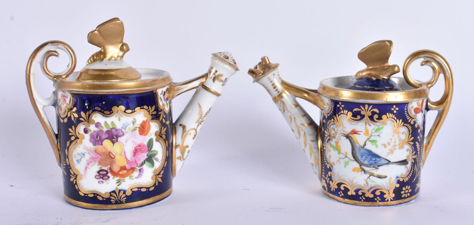 A RARE PAIR OF EARLY 19TH CENTURY ENGLISH PORCELAIN WATERING CANES possibly cruets. 9.5 cm wide. (1 of 6)