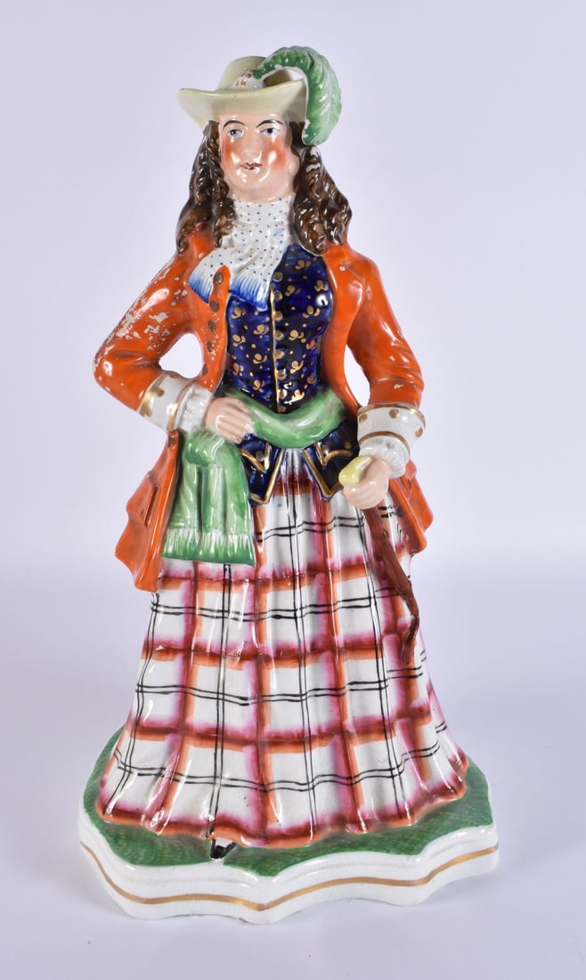 AN ANTIQUE STAFFORDSHIRE FIGURE OF A FEMALE modelled holding a staff upon a shaped base. 33 cm x 12 (1 of 6)