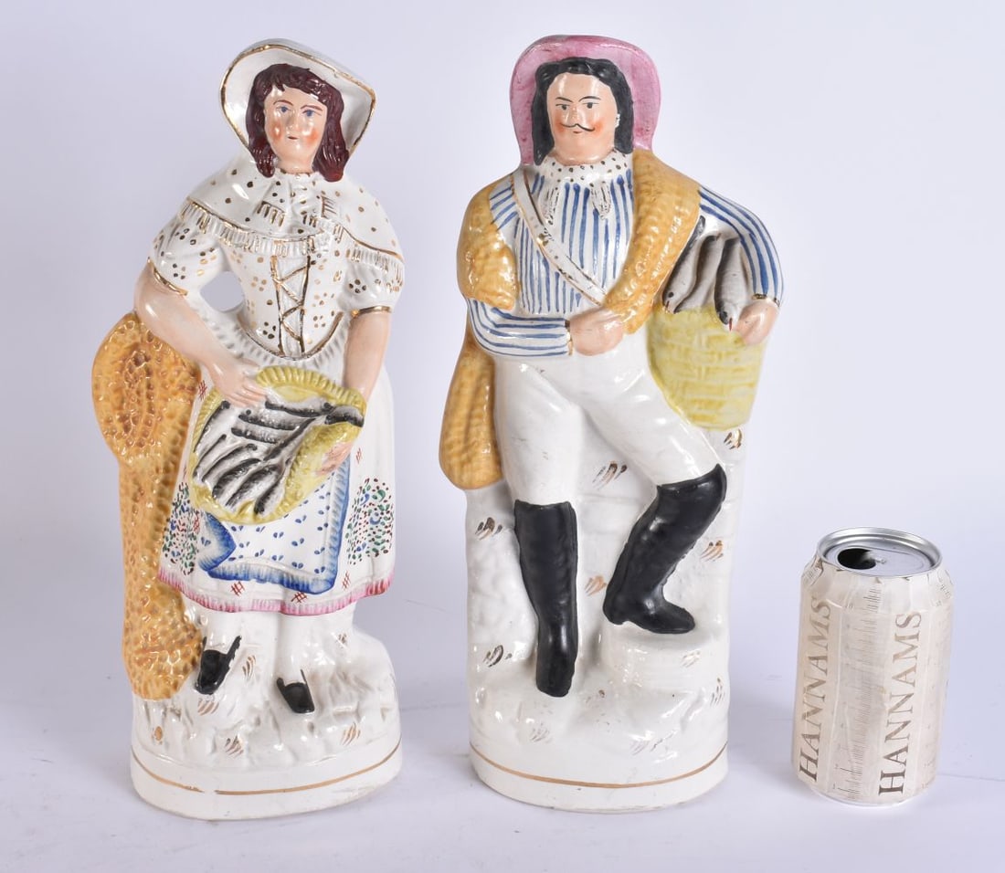 A PAIR OF VICTORIAN STAFFORDSHIRE FISHERMAN. 34 cm x 10 cm.: A PAIR OF VICTORIAN STAFFORDSHIRE FISHERMAN. 34 cm x 10 cm.