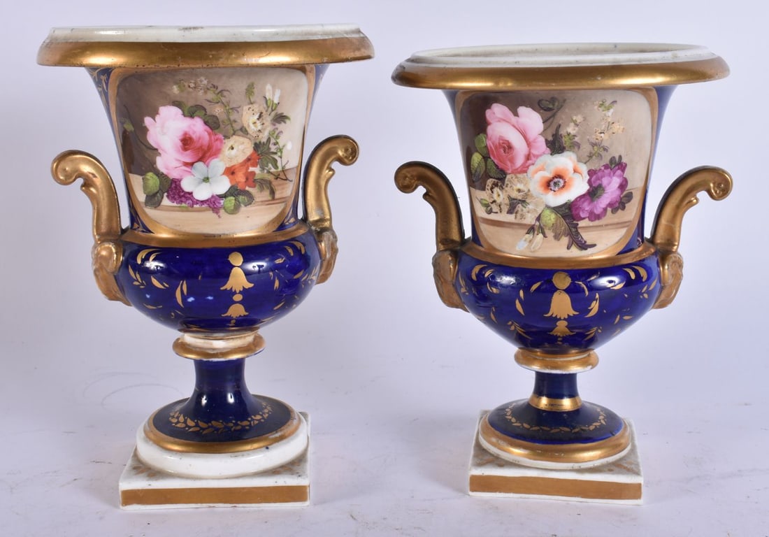 A NEAR PAIR OF EARLY 19TH CENTURY ENGLISH DERBY PORCELAIN VASES painted with flowers. 17 cm high. (1 of 5)