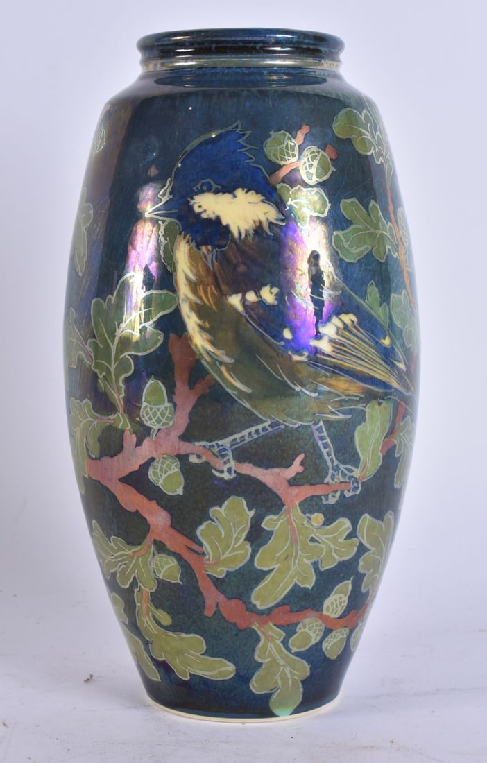 A PILKINGTONS LUSTRE STYLE VASE painted with a bird and foliage. 23.5 cm high. (1 of 4)